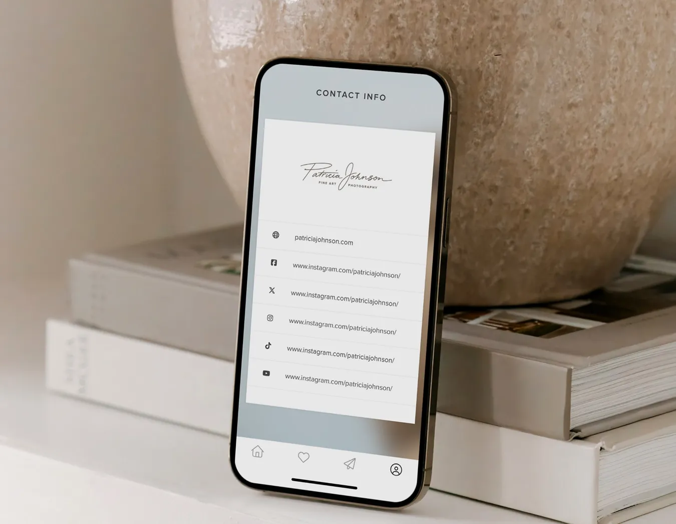 foto.umbii.boo Mobile Gallery App is a great way to increase brand awareness. Here, the Mobile Gallery is open & displaying photographer's contact information and social media links on a smartphone.